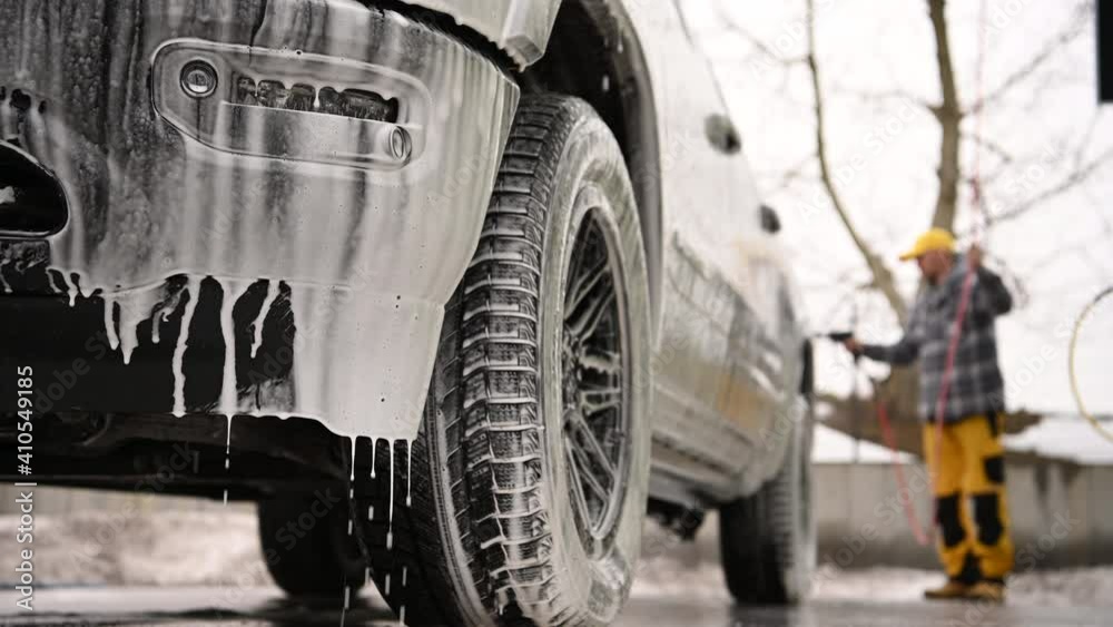 Car Washing Using Pressure Washer. Caucasian Men Cleaning His Modern Pickup Truck Car Washing Using Pressure Washer. Caucasian Men Cleaning His Modern Pickup Truck