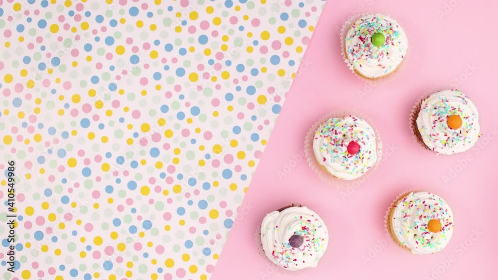 Cup cakes with cream appear on pastel background. Stop motion Cup cakes with cream appear on pastel background. Stop motion