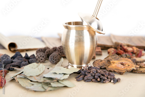 All kinds of traditional Chinese medicine and pestle on the table photo