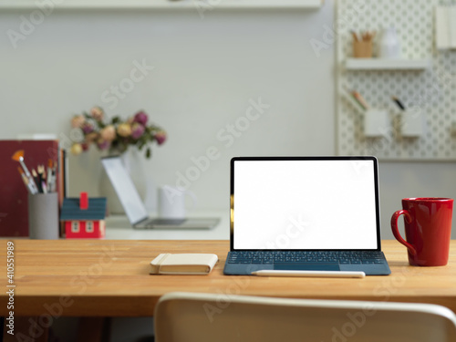 Office room with laptop, mug and copy space on the table with office supplies © bongkarn
