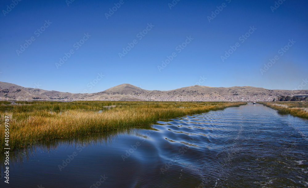 Landscape view of Uros floating islands, Lake Titicaca, Puno, Peru Landscape view of Uros floating islands, Lake Titicaca, Puno, Peru
