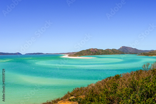 Fototapeta Naklejka Na Ścianę i Meble -  Panorama of iconic and amazingly beautiful Whitehaven Beach in the Whitsunday Coast, Queensland taken in summer time on a beautiful blue sky day. 