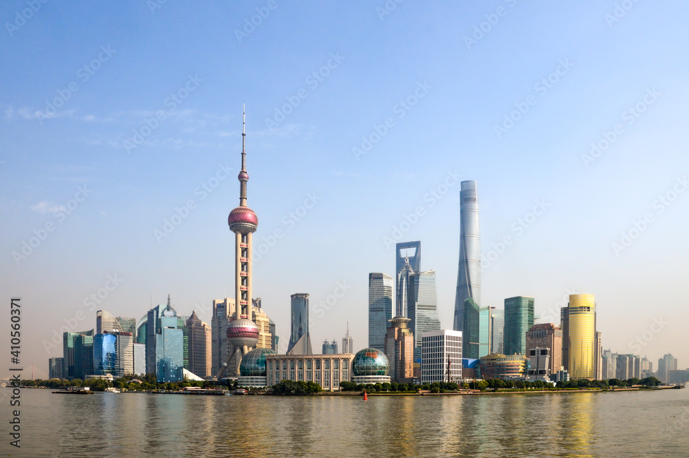 City of Shanghai in China, taken on a blue sky day in summer time with the Huangpu River running in front of the CBD, main city area. 