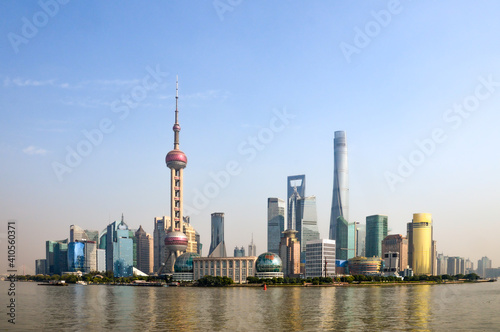 City of Shanghai in China, taken on a blue sky day in summer time with the Huangpu River running in front of the CBD, main city area. 