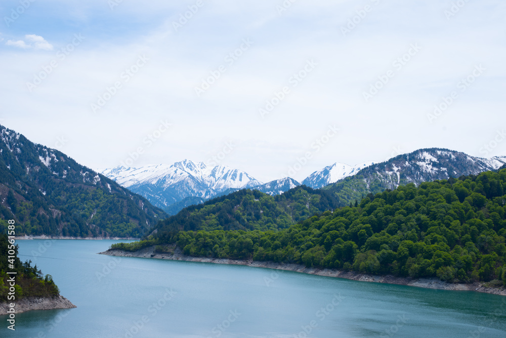 Beautiful lake, ferry and mountain in Kurobe dam, Toyama, Japan Beautiful lake, ferry and mountain in Kurobe dam, Toyama, Japan