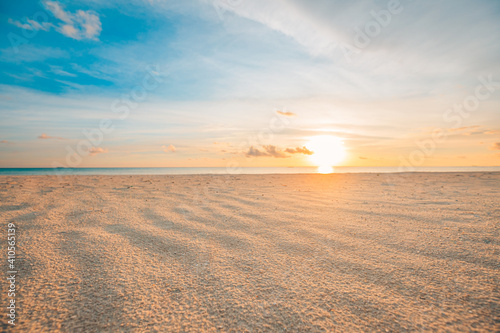 Fototapeta Naklejka Na Ścianę i Meble -  Closeup sea sand beach. Panoramic beach landscape. Inspire tropical beach seascape horizon. Orange and golden sunset sky calmness tranquil relaxing sunlight summer mood. Vacation travel holiday banner