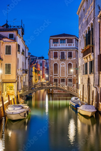 Beautiful small canal in Venice at night