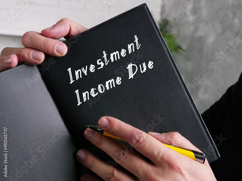  Financial concept about Investment Income Due with inscription on the sheet.