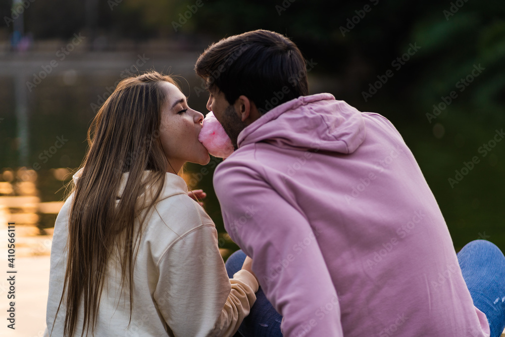Fototapeta premium Happy couple eating cotton candy, lifestyle