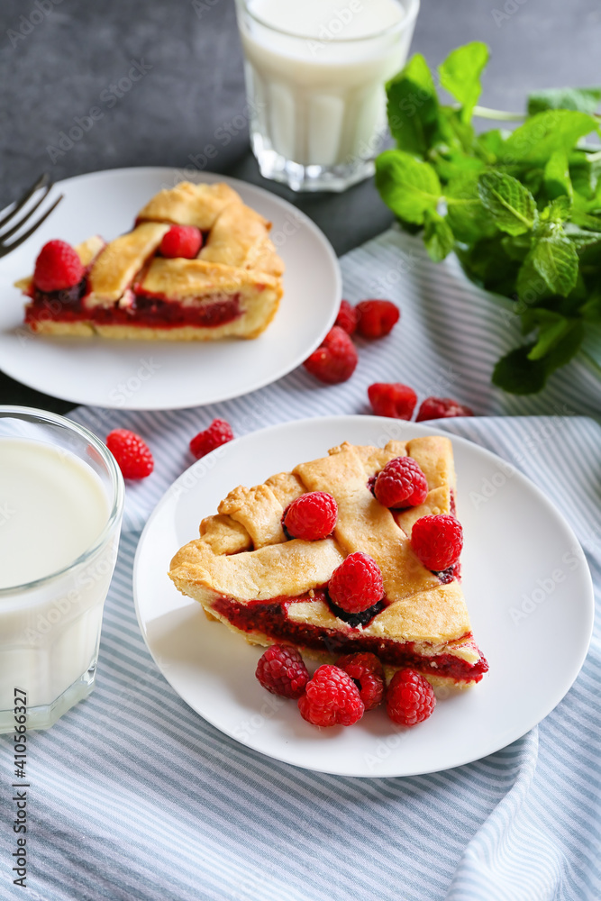 Pieces of delicious raspberry pie on table Pieces of delicious raspberry pie on table