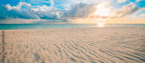 Fototapeta Naklejka Na Ścianę i Meble -  Closeup sea sand beach. Panoramic beach landscape. Inspire tropical beach seascape horizon. Orange and golden sunset sky calmness tranquil relaxing sunlight summer mood. Vacation travel holiday banner