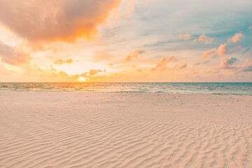Closeup sea sand beach. Panoramic beach landscape. Inspire tropical beach seascape horizon. Orange and golden sunset sky calmness tranquil relaxing sunlight summer mood. Vacation travel holiday banner