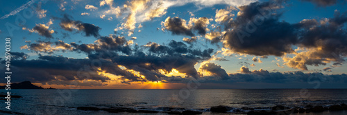 beautiful cloudy sky over the sea at sunrise or sunset