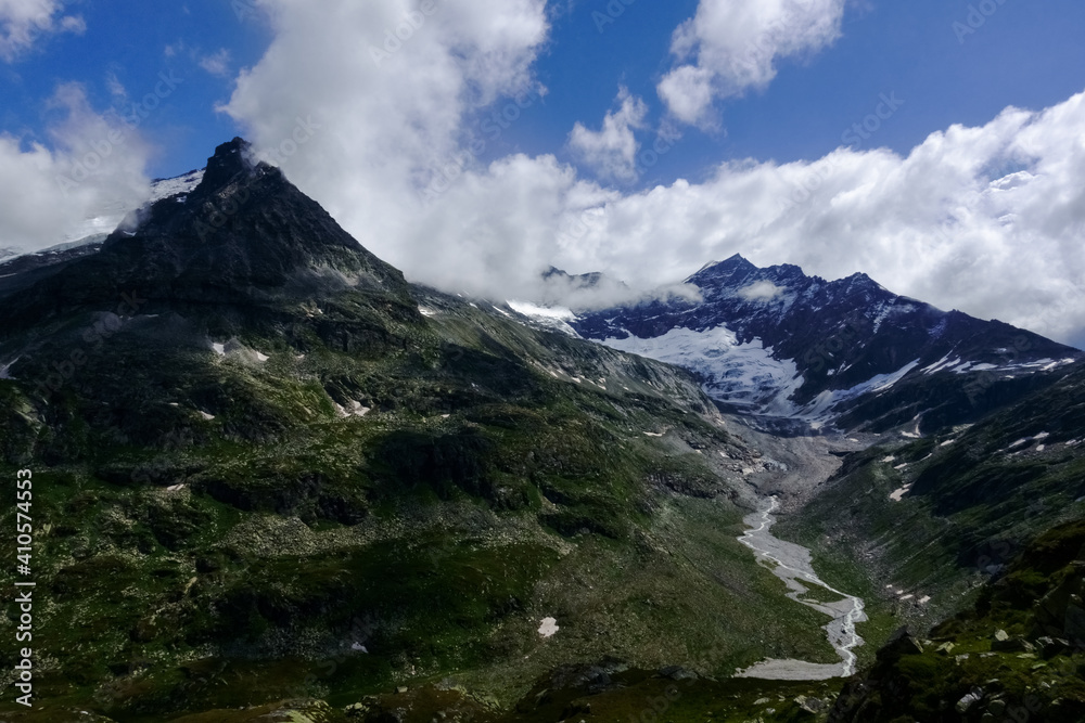 huge glacier with a mountains creek in the mountains huge glacier with a mountains creek in the mountains