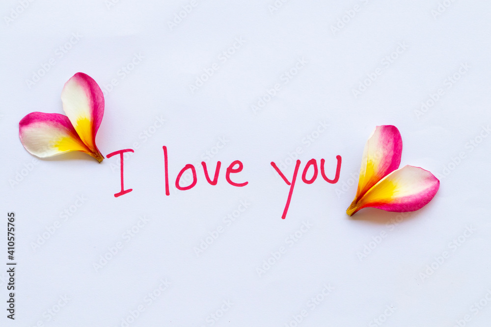 i love you message card handwriting with flowers frangipani arrangement  hearts flat lay postcard style on background white