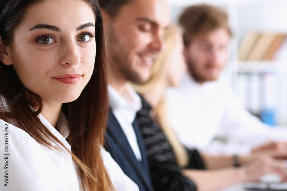 Beautiful smiling woman portrait with group of people listen carefully during seminar. Study event, client conversation, job, customer support service, case hear in court, leader performance concept Beautiful smiling woman portrait with group of people listen carefully during seminar. Study event, client conversation, job, customer support service, case hear in court, leader performance concept