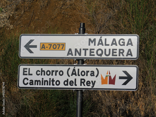 Sign post indicating direction to region capitol and Point of interest