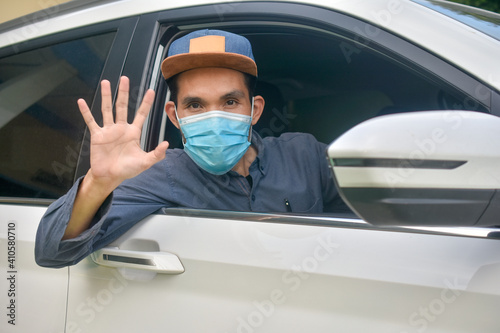 Asian man wear medical mask sitting in car to protect coronavirus covid19 ,Mask prevent PM2.5