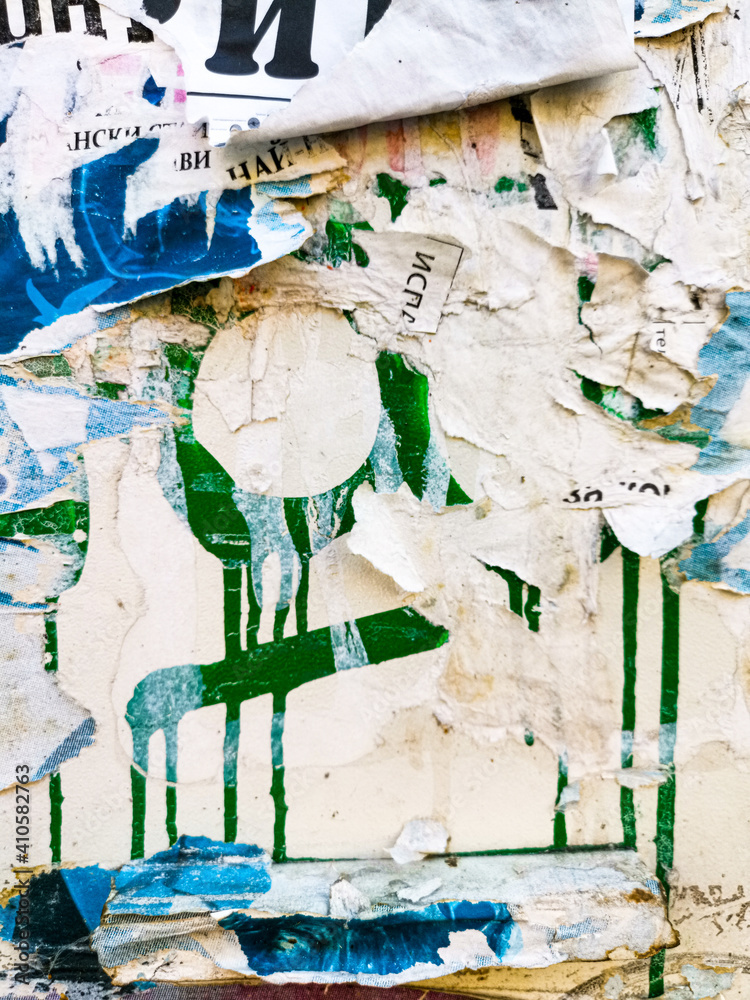 Layers of old colorful posters on wall damaged by time for your grunge style design Layers of old colorful posters on wall damaged by time for your grunge style design