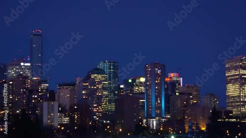 Wallpaper Mural Evening offices hotel sklyline downtown Edmonton capital city Canada Alberta as building lights cars less traffic during the quiet bokeh blur of skyscrappers in dark navy blue horizon nite fall LED's Torontodigital.ca