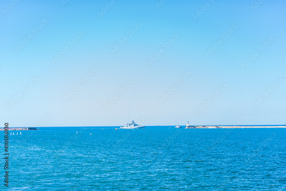 Coastline and waves in the sea, sunny Crimean summer. Horizontal orientation