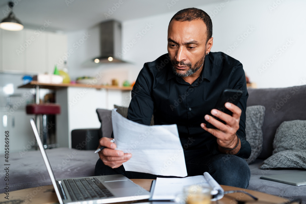 40 years old man accounting at home 40 years old man accounting at home