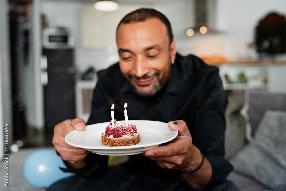 40 years old man celebrating his birthday at home