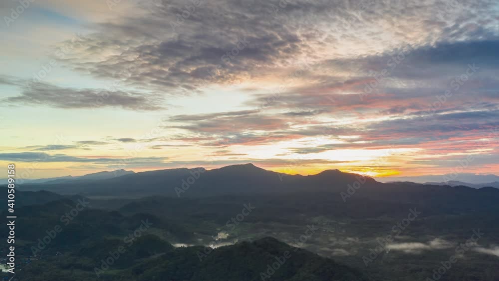 Hyper lapse 4K, Aerial view of drone evening view dramatic sky, sunset behind the mountains, colorfully, Mae Moh, Thailand. Hyper lapse 4K, Aerial view of drone evening view dramatic sky, sunset behind the mountains, colorfully, Mae Moh, Thailand.