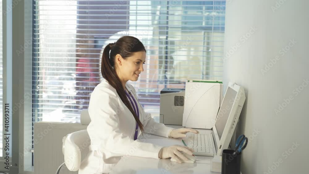 Female doctor using pc computer while sitting at work place. Healthcare, insurance and medicine concept. Female doctor using pc computer while sitting at work place. Healthcare, insurance and medicine concept.