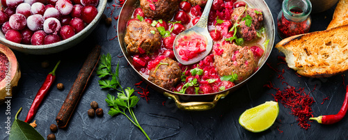 Картината върху платно Lamb meatballs in cherry sauce