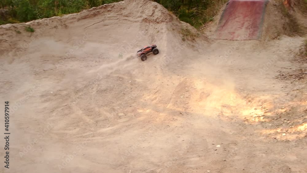 Offroad RC car on the sand. Fast radio controlled buggy car on a race on the sandy road. Offroad RC car on the sand. Fast radio controlled buggy car on a race on the sandy road.