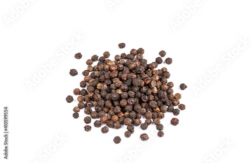Dried black pepper on the white background