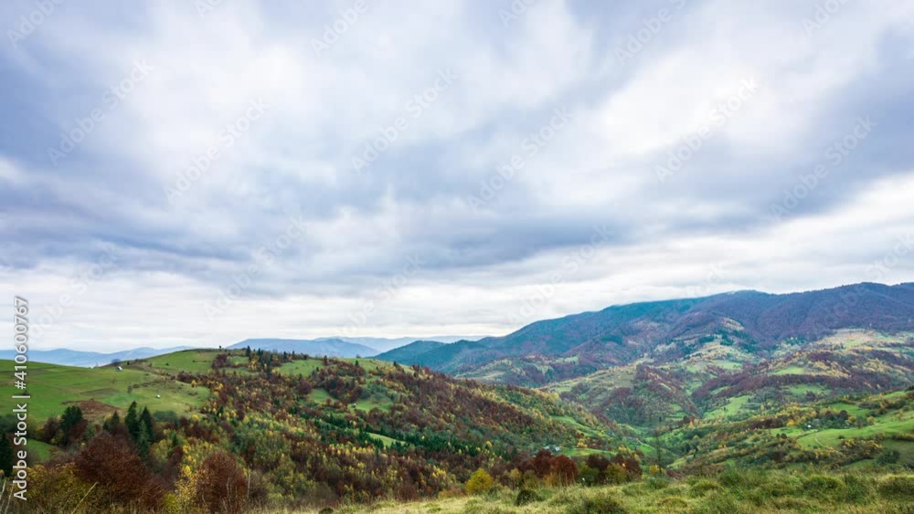 Sky with white and fluffy layer of clouds over green autumn hills, 4K UHD time lapse Sky with white and fluffy layer of clouds over green autumn hills, 4K UHD time lapse