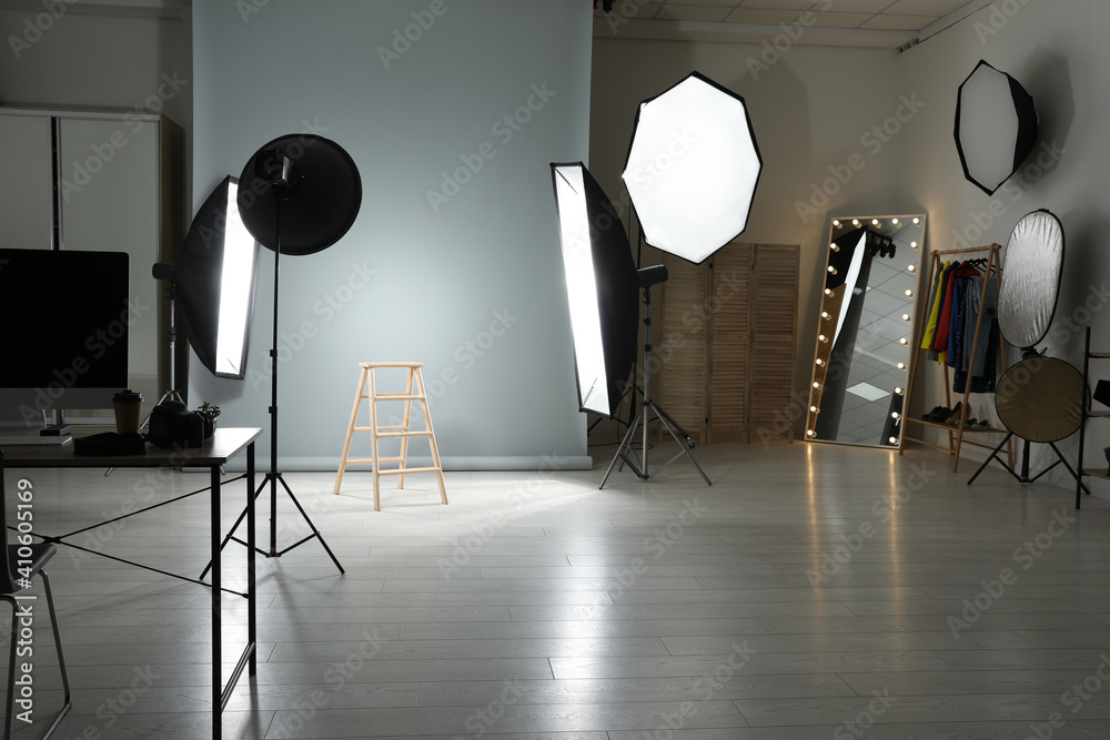 Interior of modern photo studio with professional equipment - obrazy, fototapety, plakaty 