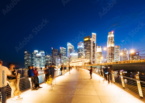 Toruist at Jubilee Bridge at night For Sightseeing In Singapore City. photo