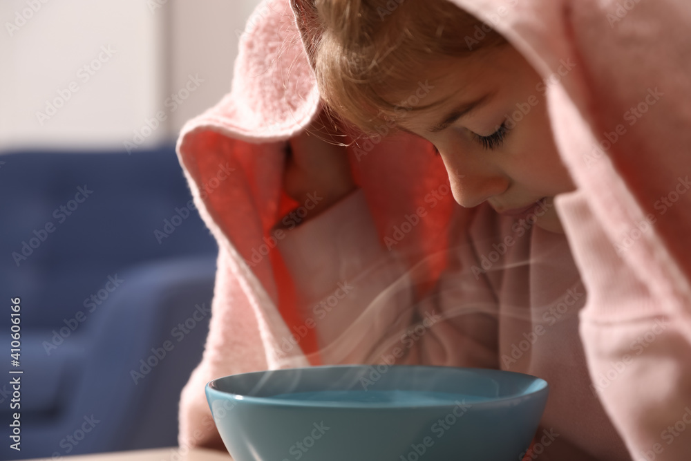 Little girl covering head with towel and inhaling steam indoors, closeup - obrazy, fototapety, plakaty 