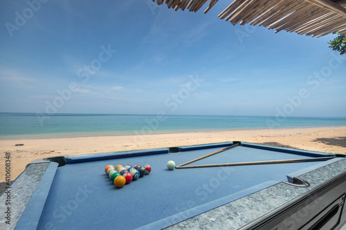 Blue Pool table and balls with sea view © Tony Ruji