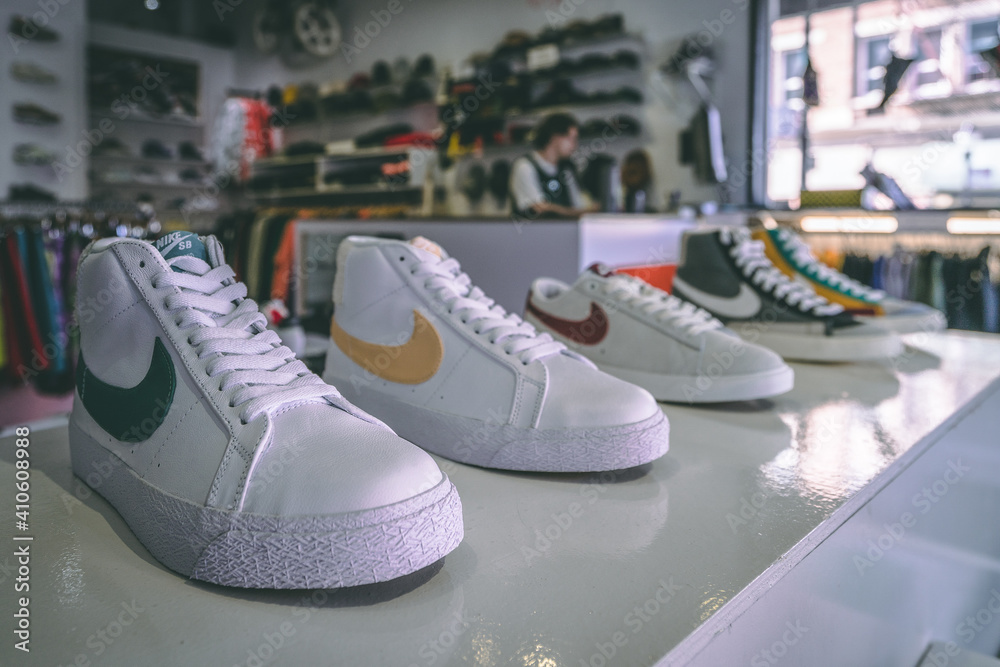 VANCOUVER, CANADA - Aug 20, 2019: White Nike Blazer sneaker shoes on  display store clerk in the background behind cashier Stock Photo | Adobe  Stock