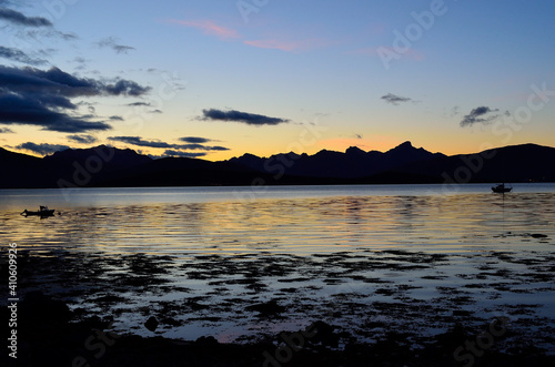 colourful sky, mountain and fjord as the sun is going down for the night