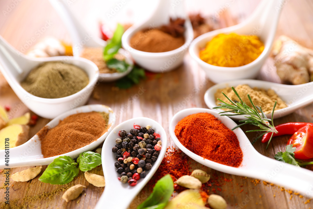 various spices on wood background