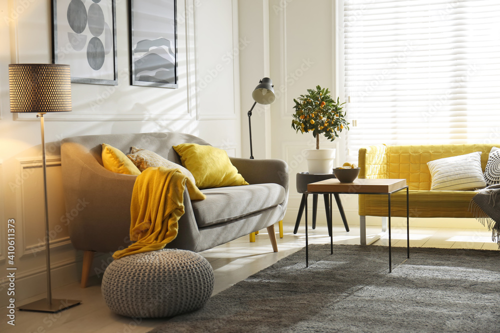 Stylish living room with sofas. Interior design in grey and yellow colors - obrazy, fototapety, plakaty 