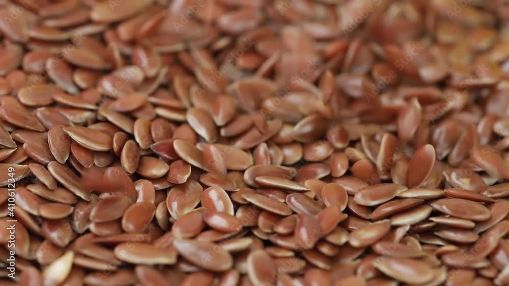 Close view of dropping flax seeds, Flax seeds dropping view