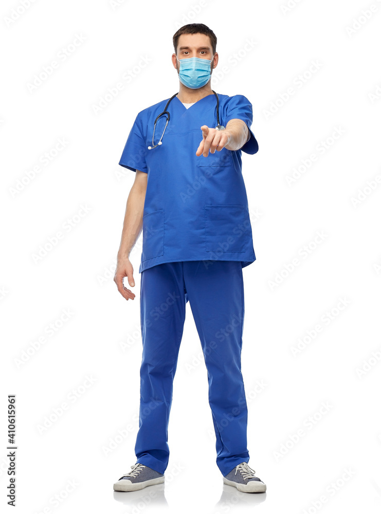 healthcare, profession and medicine concept - doctor or male nurse in blue uniform, face protective medical mask for protection from virus disease and gloves pointing to camera over white background healthcare, profession and medicine concept - doctor or male nurse in blue uniform, face protective medical mask for protection from virus disease and gloves pointing to camera over white background
