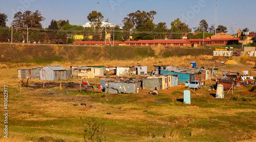 JOHANNESBURG, SOUTH AFRICA - Jul 04, 2018: Low income informal tin shack housing in urban Sowetp