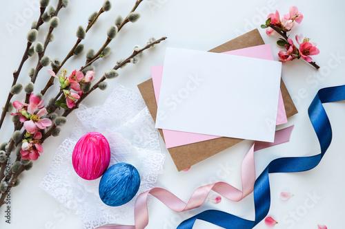 Easter card mockup. Easter eggs, spring flowers  and willow twigs 