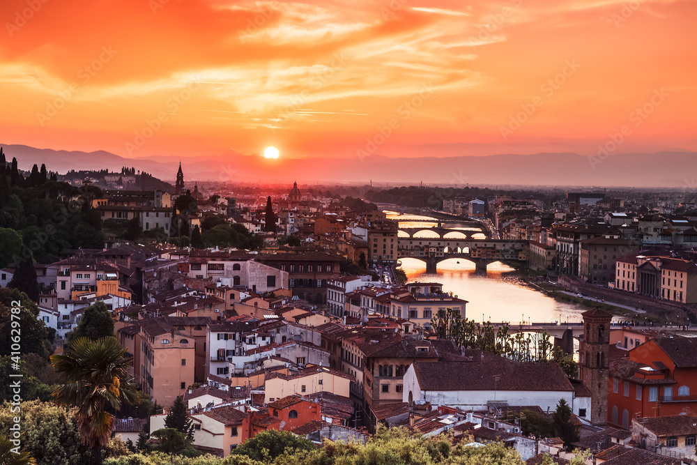 Colorful sunset over Florence, the Ponte Vecchio bridge on the Arno river, Florence, Italy