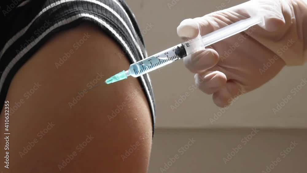 Close-up of hands injecting patient chubby arm. Doctor getting ready give a patient injection. Full HD Close-up of hands injecting patient chubby arm. Doctor getting ready give a patient injection. Full HD