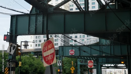 Medium, stop sign under an iron overpass, Long Island City, USA