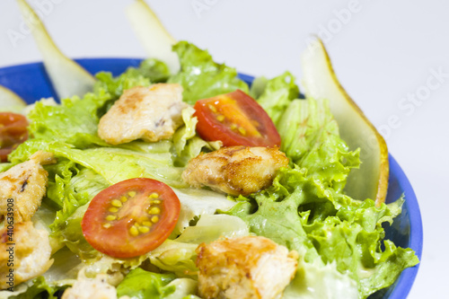 Nowl of healthy salad with chicken and lettuce photo