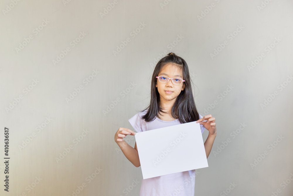 Asian girl with white sheet of paper, girl holding empty blank paper, mock up blank sign for message creative design concepts. Asian girl with white sheet of paper, girl holding empty blank paper, mock up blank sign for message creative design concepts.